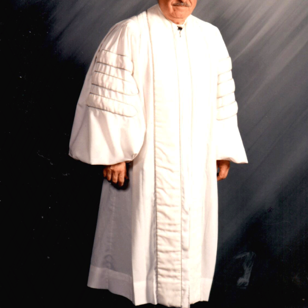 Ike Azose in his white hazzan robe, used primarily for Holidays. Image courtesy Ike Azose