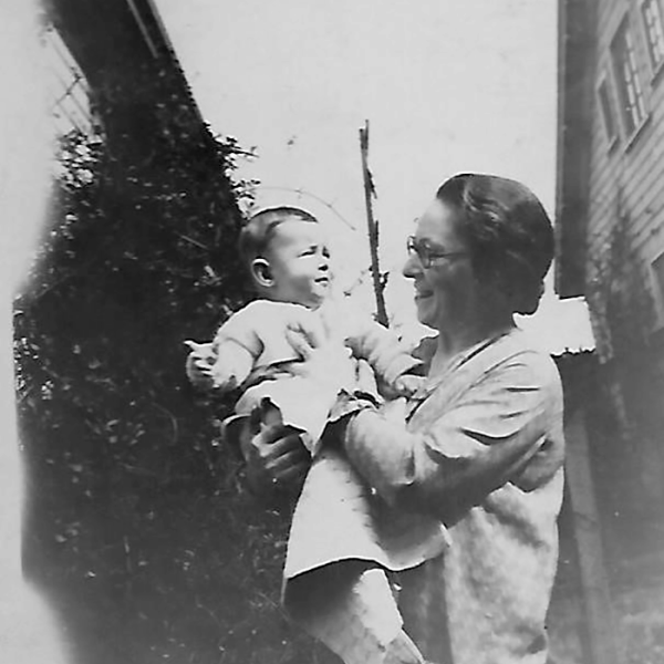 A very young Joe Greengard held by his mother, Bernice Greengard.
