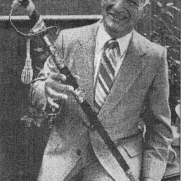 Herb with his father's sword which he used ceremoniously for many years in his own naval career. Photo Courtesy Bridge Family. 