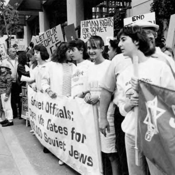 People holding signs at rally coinciding with the opening of the U.S.-Soviet Sister Cities Conference, 1987 Photo Courtesy of UW Special Collections