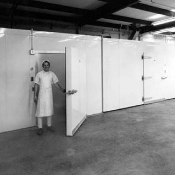 David Brenner stands in the doorway of the retarder at Brenner Brothers Bakery in Bellevue ca. 1970-1972