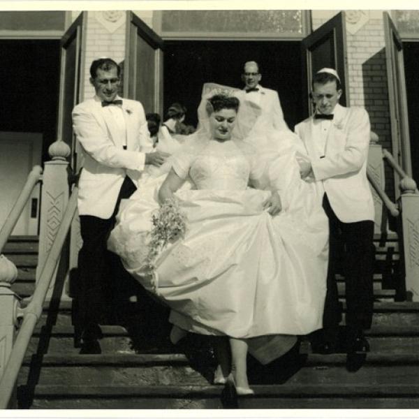 Wedding party descending the front steps of the Bikur Cholim synagogue