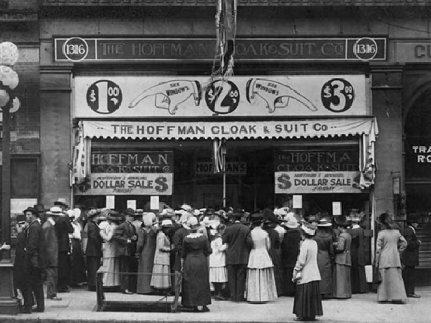 Exterior of Hoffman Cloak & Suit Company with crowd in front, Seattle, 1910