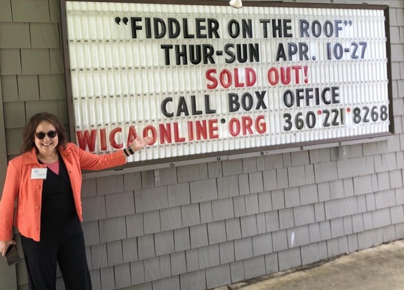 Lisa Kranseler standing outside of the WICA showing of Fiddler on the Roof