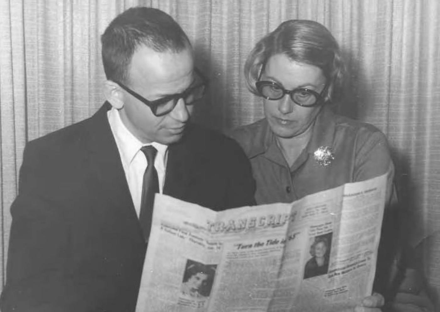 Two people reading the Jewish Transcript, Seattle Hebrew Academy, approximately 1962
