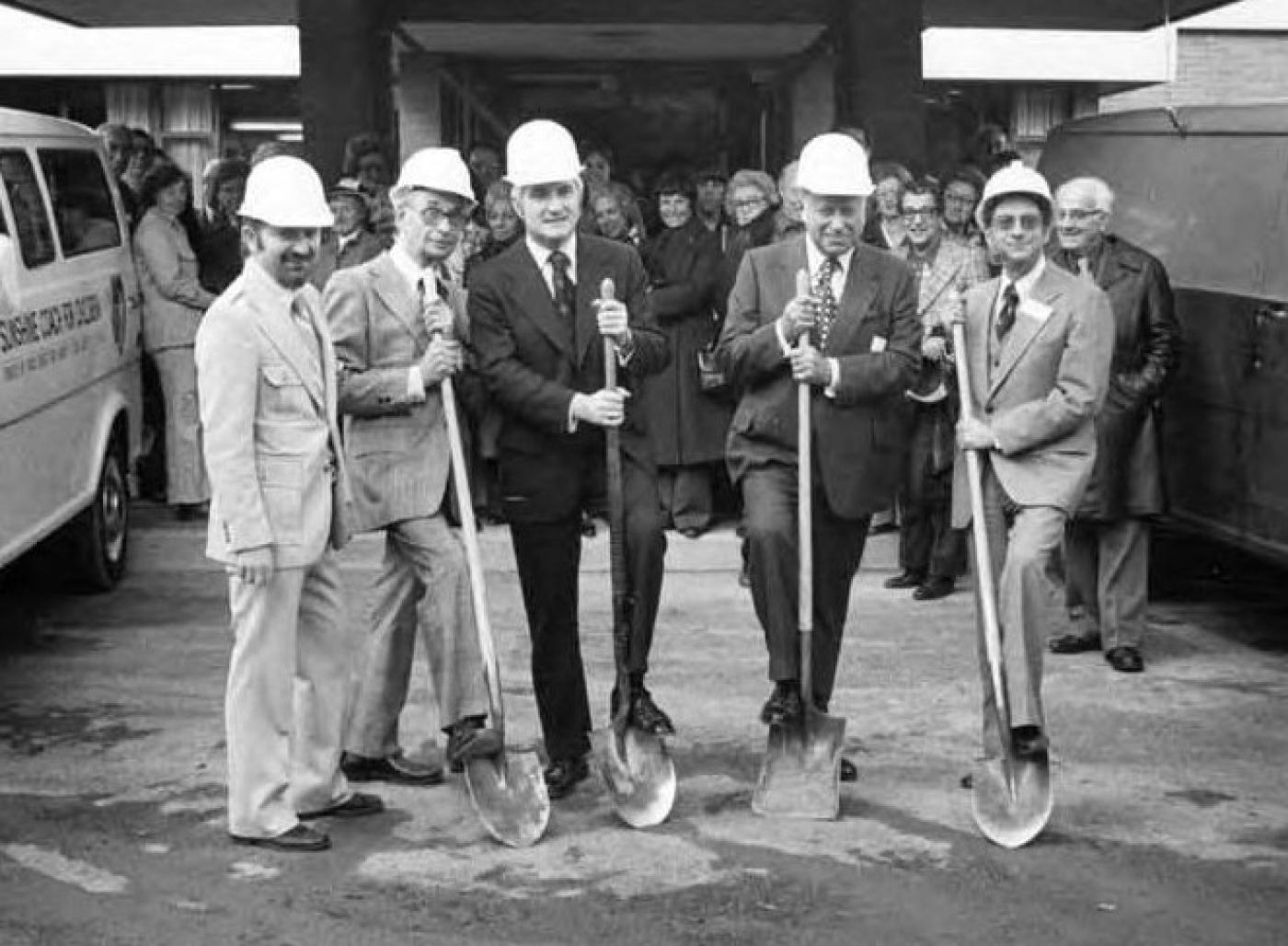 Groundbreaking ceremony group posing with shovels for the Esfeld addition to the Carolyn Kline Galland Home, 1975