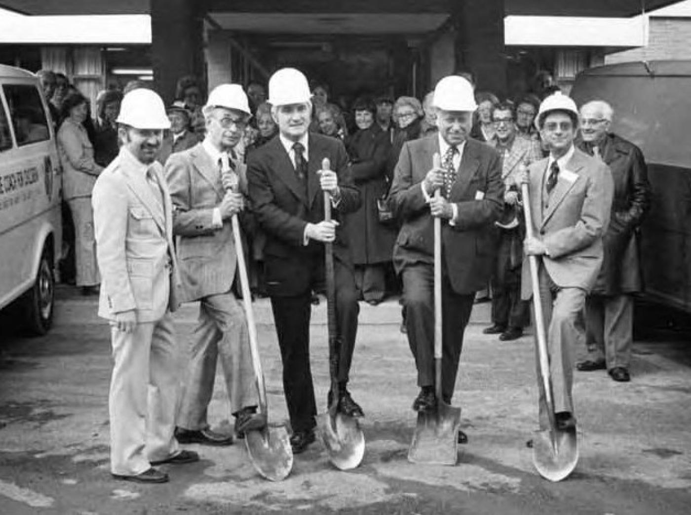 Groundbreaking ceremony group posing with shovels for the Esfeld addition to the Carolyn Kline Galland Home, 1975
