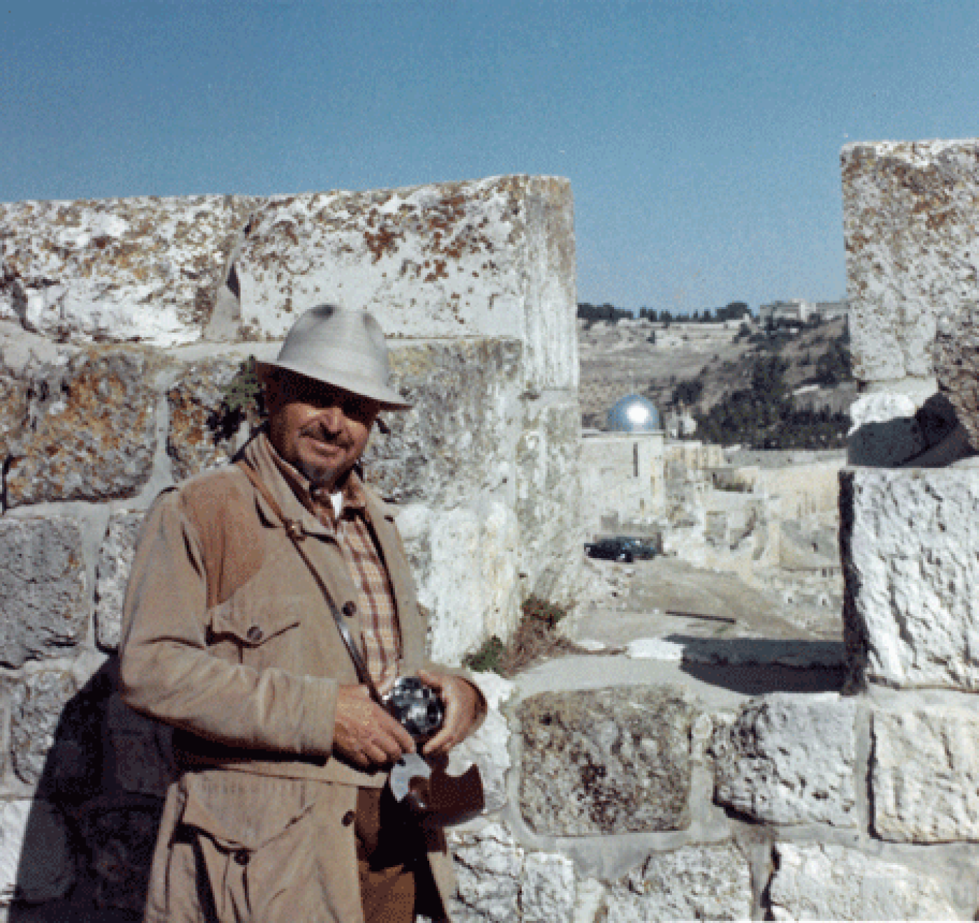 Sam Israel atop a wall overlooking the Old City of Jerusalem, built during the 16th century by the Ottomans, October 1973.