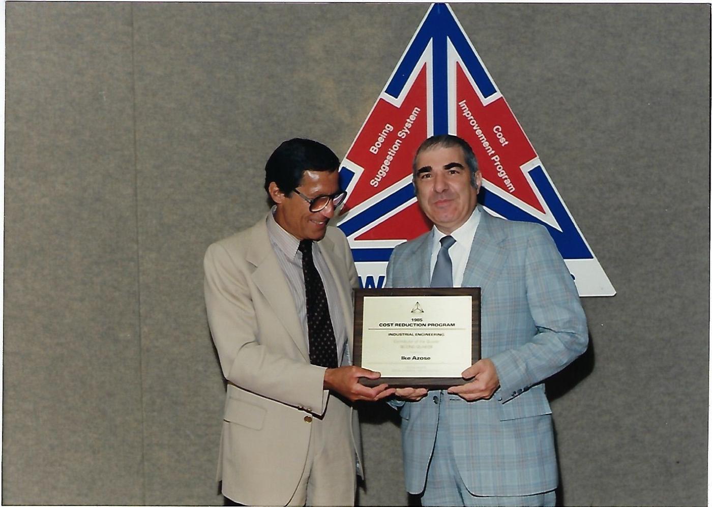 Sam Behar presents Ike Azose with the 1985 Cost Reduction Program award as part of the Boeing Suggestion System.  Image courtesy Azose family.