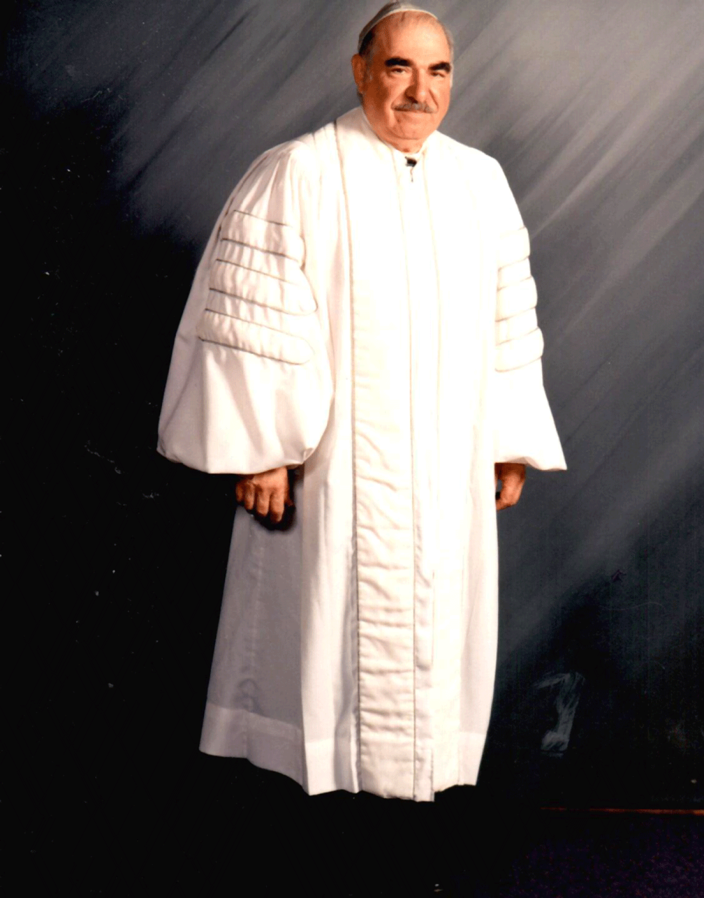 Ike Azose in his white hazzan robe, used primarily for Holidays. Image courtesy Ike Azose