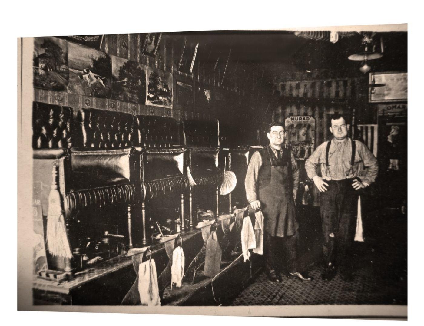 Joseph, left, and brother Isacc inside an early iteration of Angel's Shoe Repair