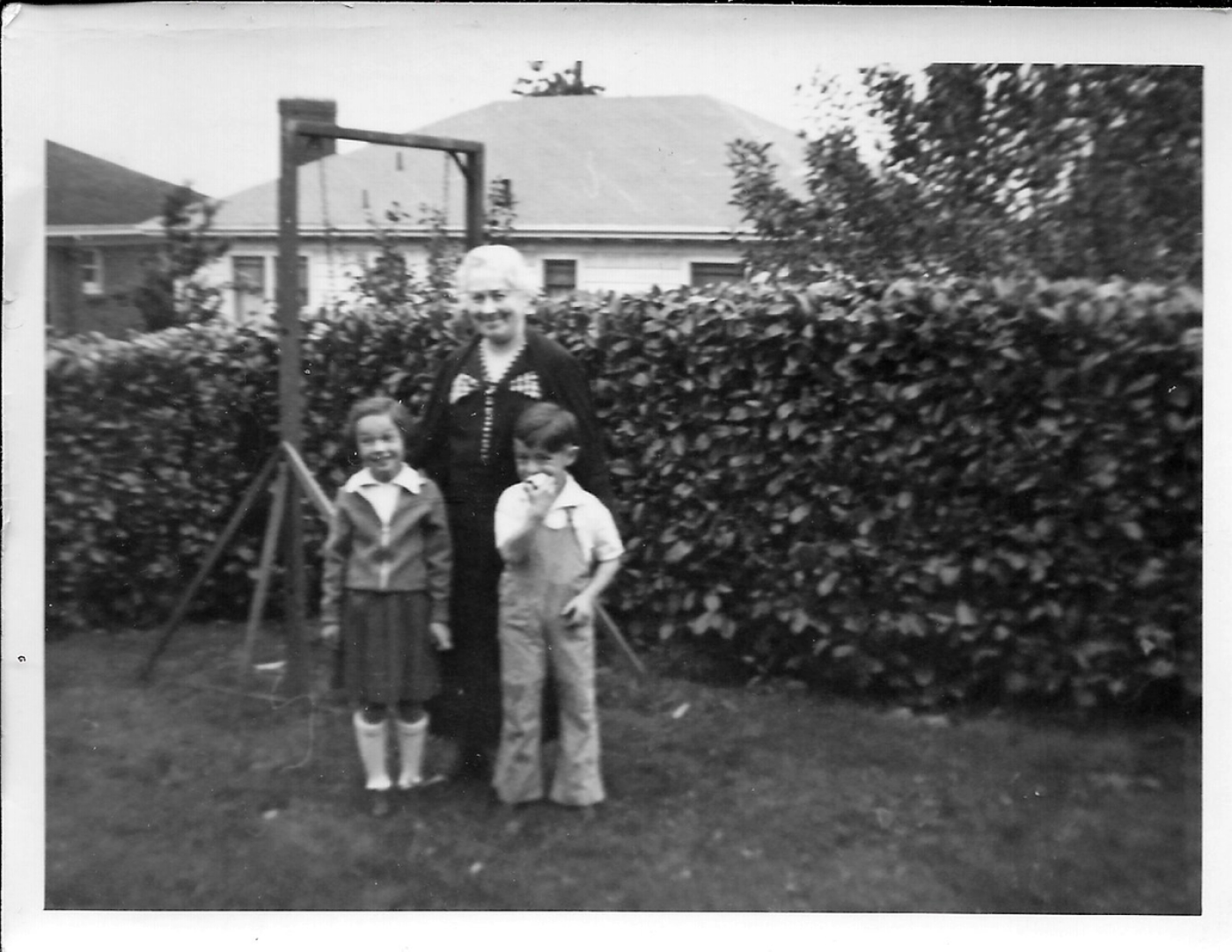 Dolly with Merle and Joe in the backyard eating apples