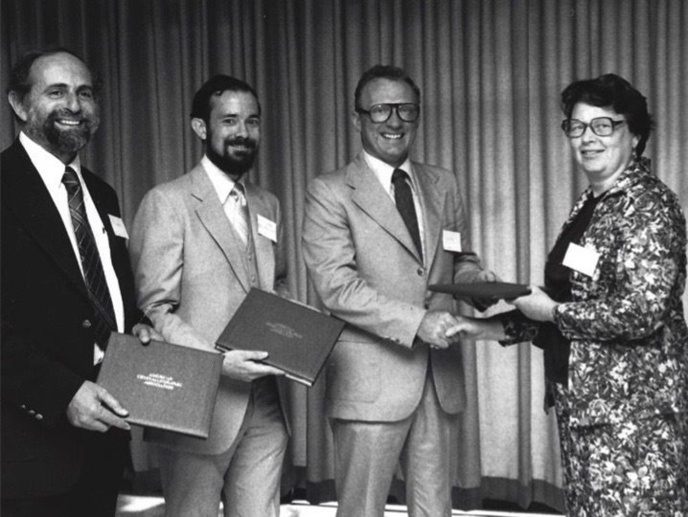 Edward A. Stern, Dale Sayers and Farrel Lytle receiving the prestigious Bertram E. Warren Diffraction Physics award from the American Crystallographic Association in 1979.