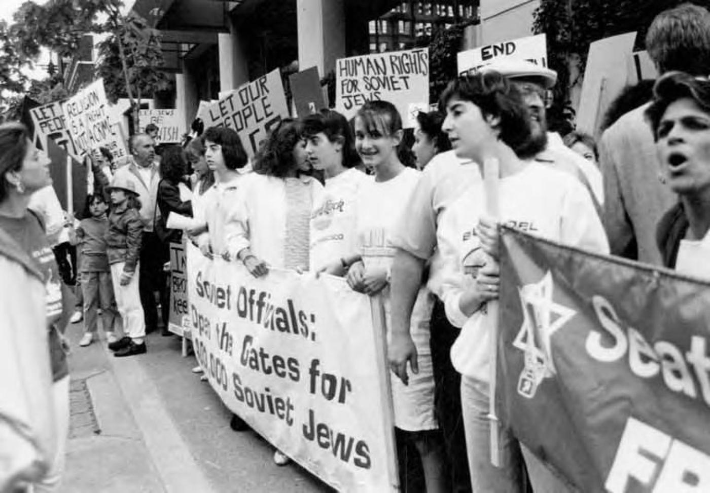 People holding signs at rally coinciding with the opening of the U.S.-Soviet Sister Cities Conference, 1987 Photo Courtesy of UW Special Collections