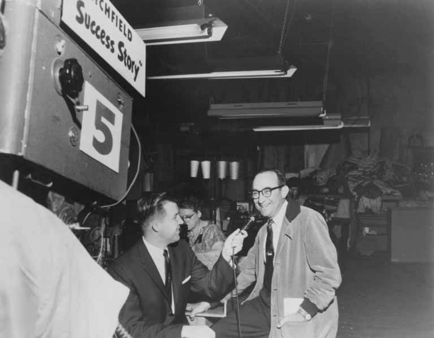 Morris Miller (right), at Seattle Quilt Mfg. Co., being interviewed for "Richfield Success Story," Seattle, Washington, approximately 1950s