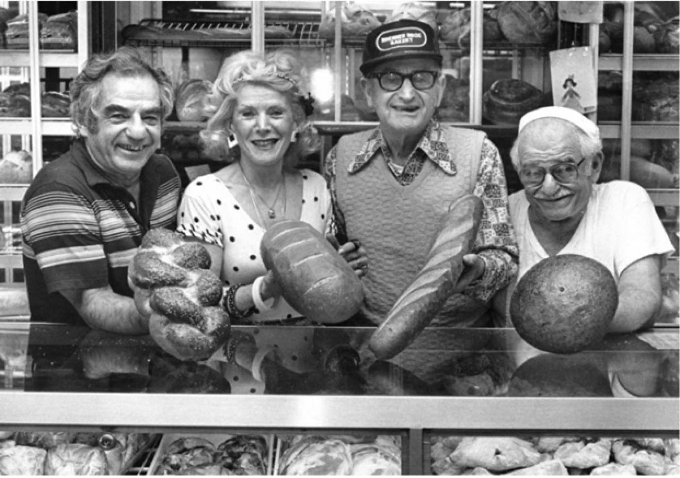 Joe, Yetta, Charlie, and Itsey Brenner in the bakery. This picture was used several times by the local news when they wrote stories about the bakery