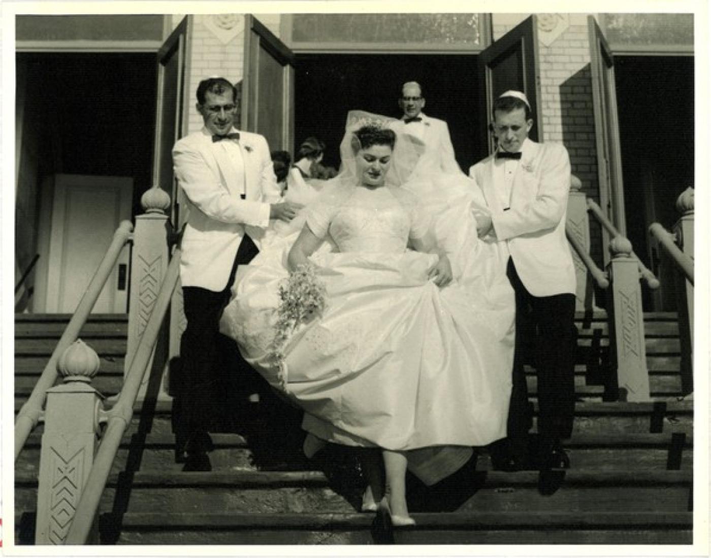 Wedding party descending the front steps of the Bikur Cholim synagogue