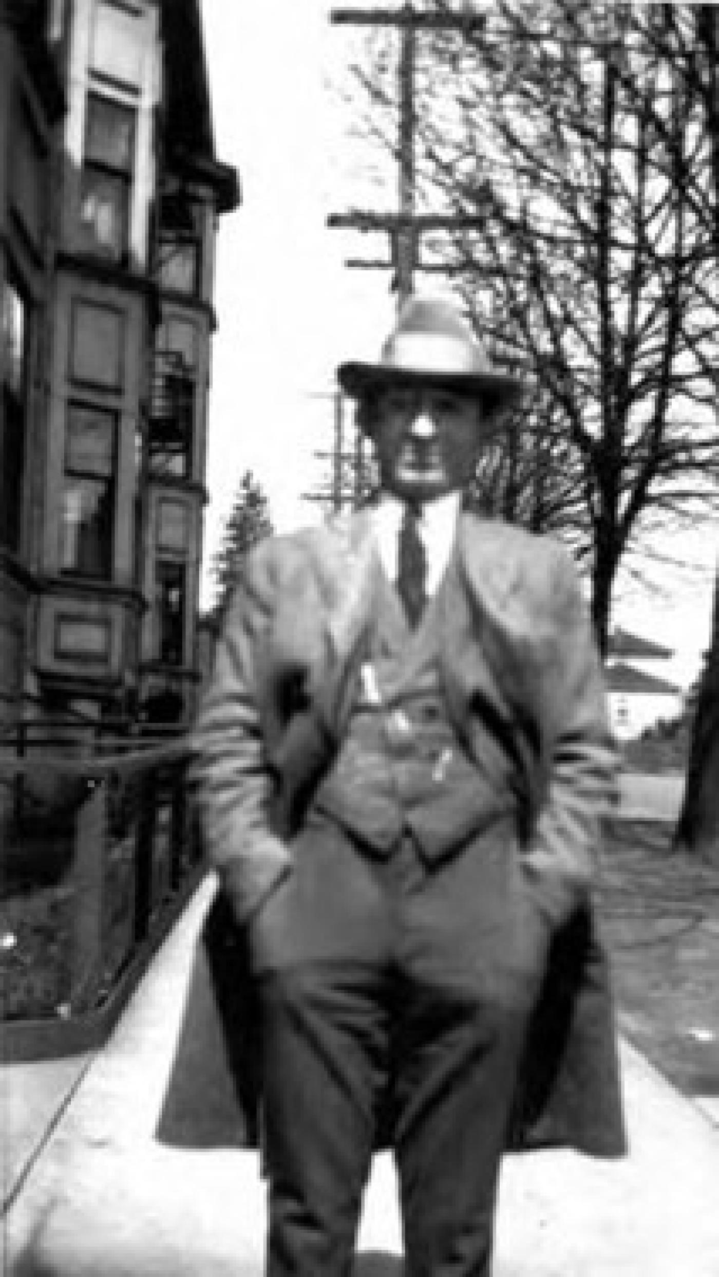 Abe Hoffman on street at 18th Ave. and Yesler Way, Seattle