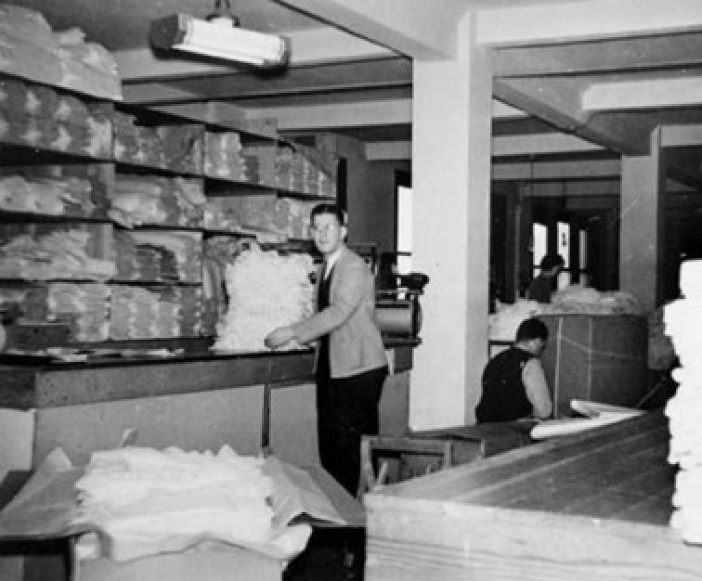 David R. Alhadeff working in Seattle Curtain stock area, Prefontaine Building, 3rd Ave. and Yesler St., Seattle, ca. 1932-1941