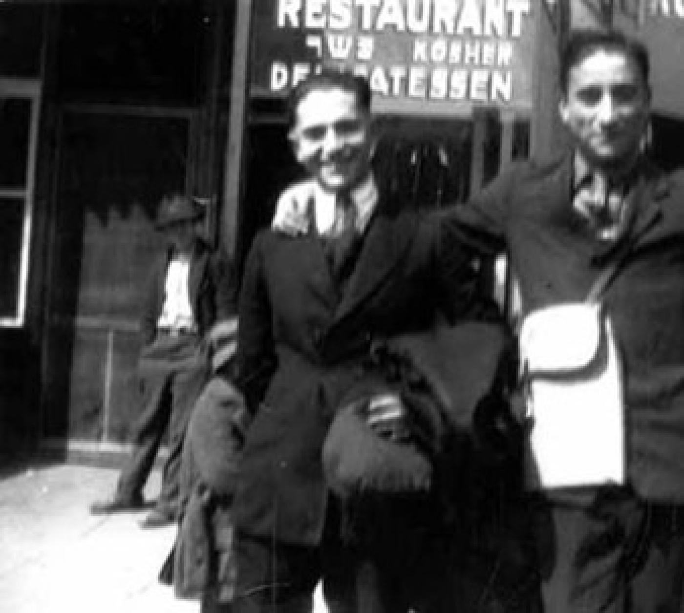 "Dodie" Doris and other man in front of Hoffman Kosher Deli and Grocery at 1714 Yesler Way, Seattle, ca. 1920s-1930s
