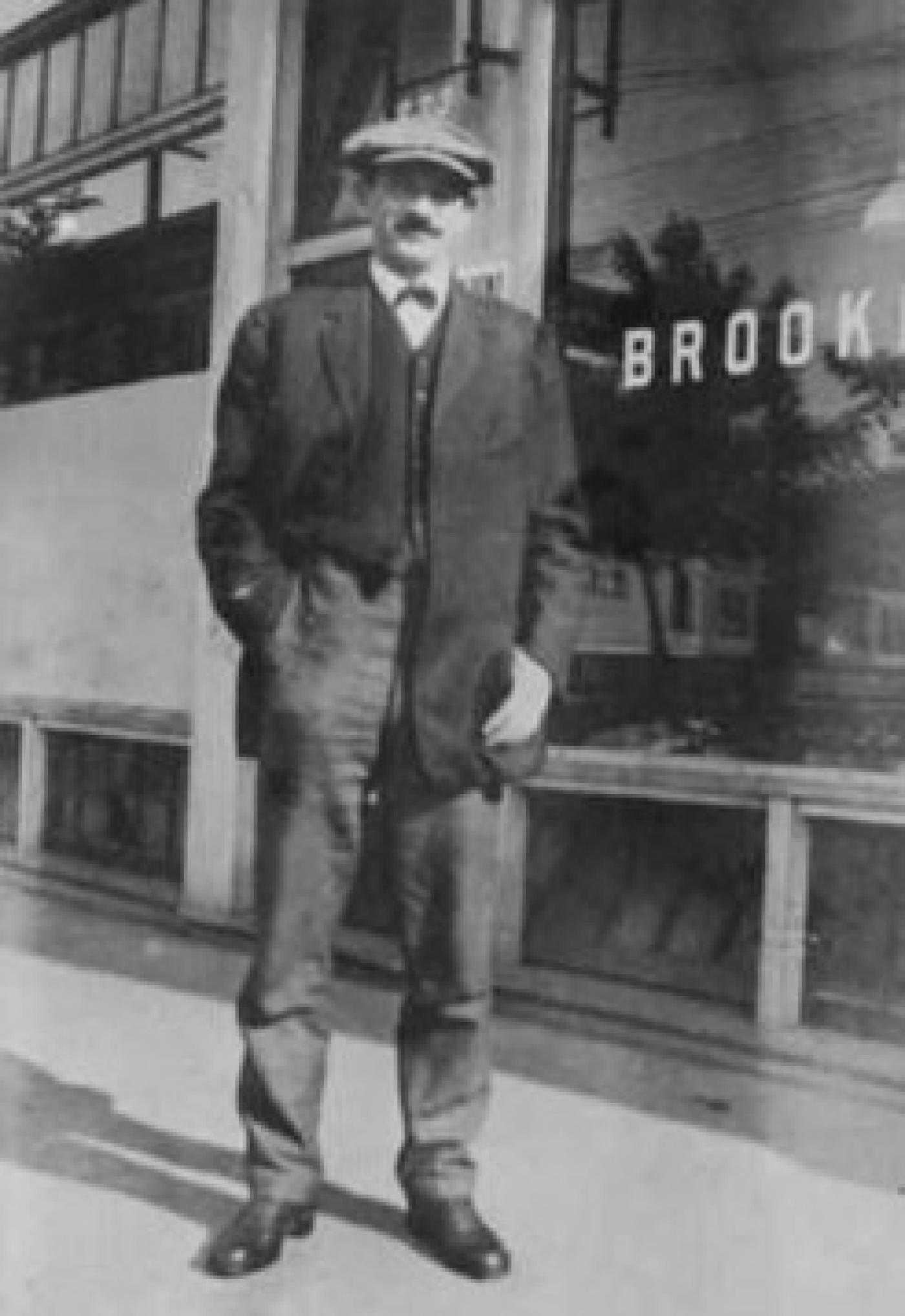 Herman Mosler outside of Brooklyn Bakery, 1233 Yesler Way, Seattle, Washington, ca. 1913