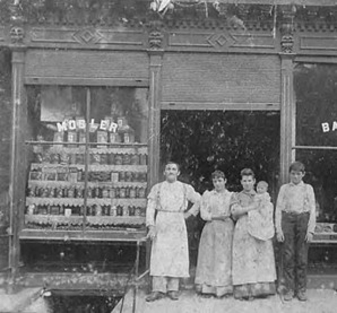 People in front of Mosler Bakery, Seattle, ca. 1892-1920s. Samuel Mosler, his brother Herman Mosler, and two employees. Possibly on Yesler near 12th Ave.