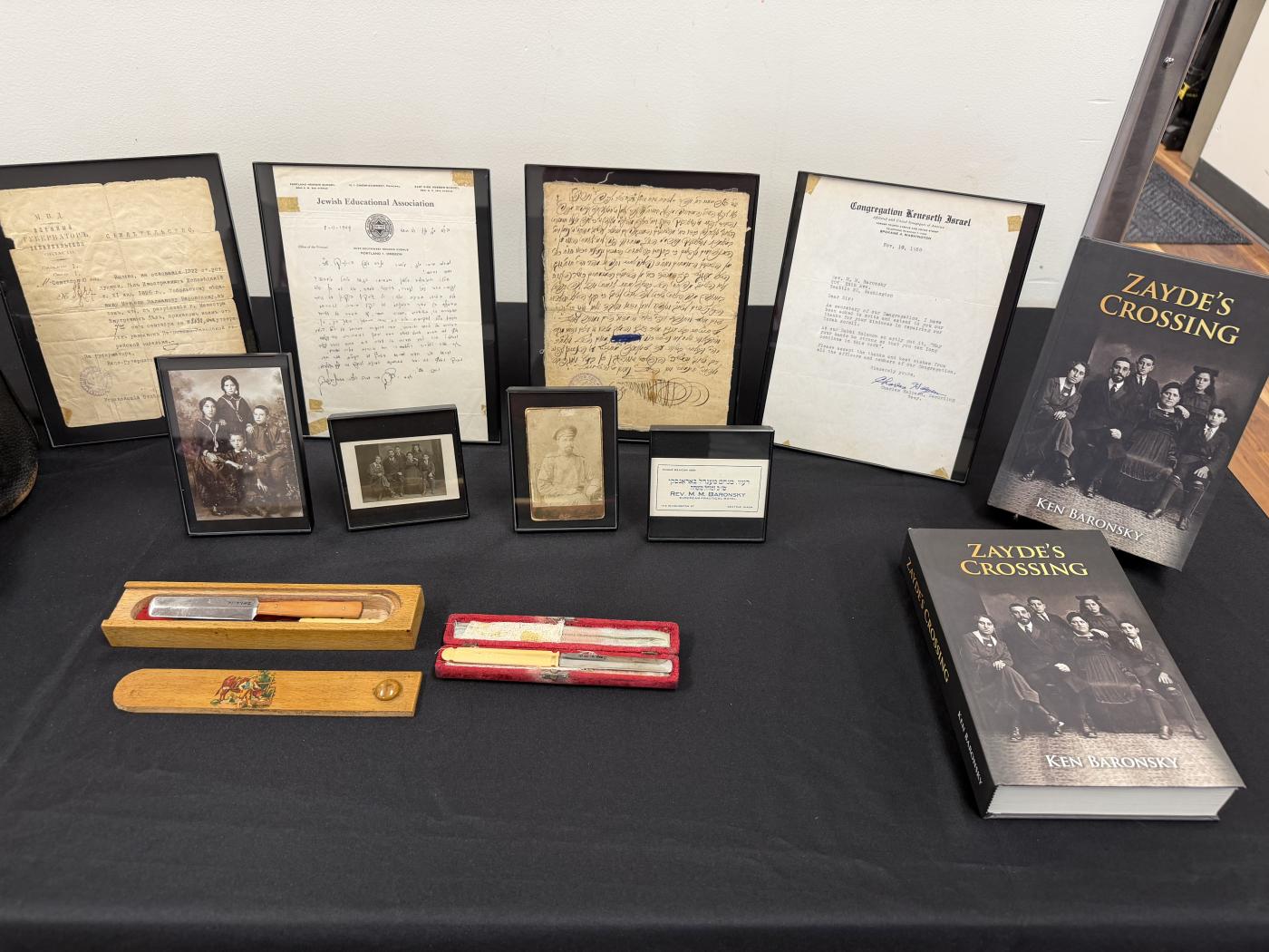 Historical items from Ken's family positioned alongside the book
