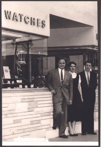 Ike Ovadia, left, outside his jewelry store, 1950s or 60s