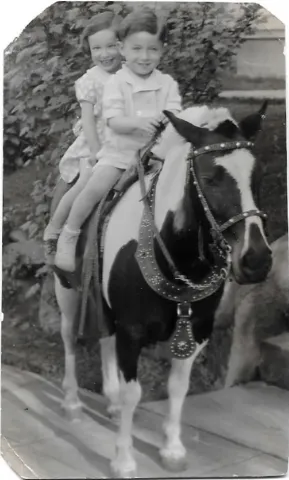 Merle and Joe learn to ride a horse
