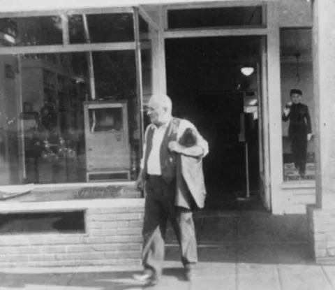 Abe Brenner, founder of Brenner's Bakery, probably at store, 1803 Yesler Way, Seattle, n.d.