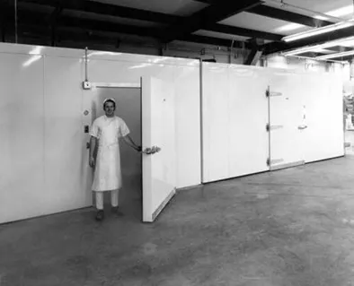 David Brenner stands in the doorway of the retarder at Brenner Brothers Bakery in Bellevue ca. 1970-1972
