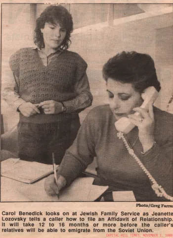 Carol Benedick looks on at Jewish Family Service as Jeanette Lozovsky tells a caller how to file an Affidavit of Relationship. It will take 12 to 16 months or more before the caller's relativese will be able to emigrate from the Soviet Union
