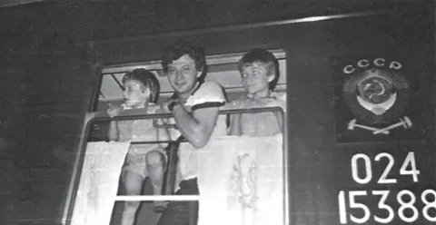 Gregory Korshin [Middle] in the train from Kazan to Moscow to leave Russia forever.png